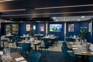 Luxurious Millichip Suite at West Bromwich Albion, featuring a complimentary bar and fine dining.