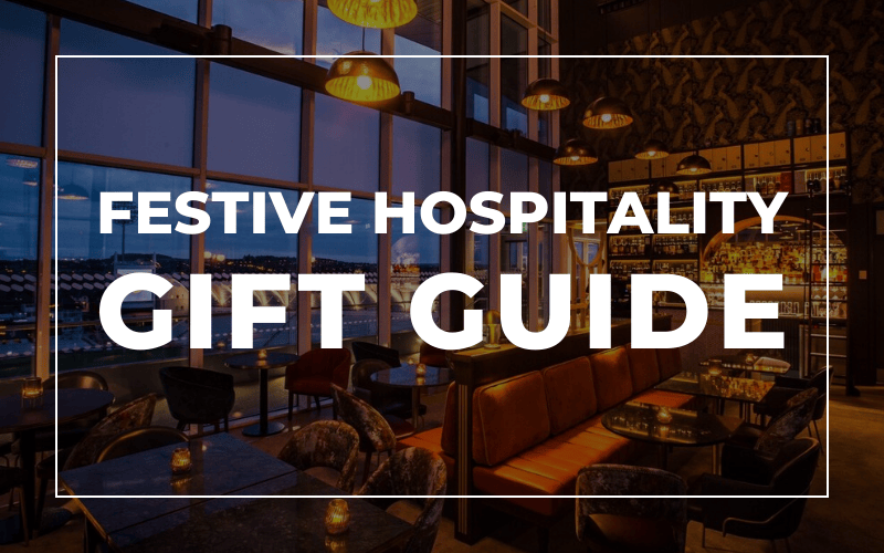 A luxury hospitality lounge with a dark overlay and the words 'Festive Hospitality Gift Guide' above